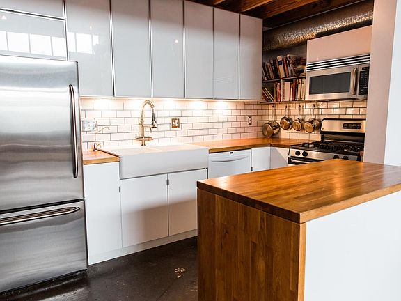 Butcher block countertops, stainless appliances