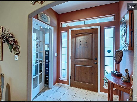 Previous owner furnishings - front entry with side office/den