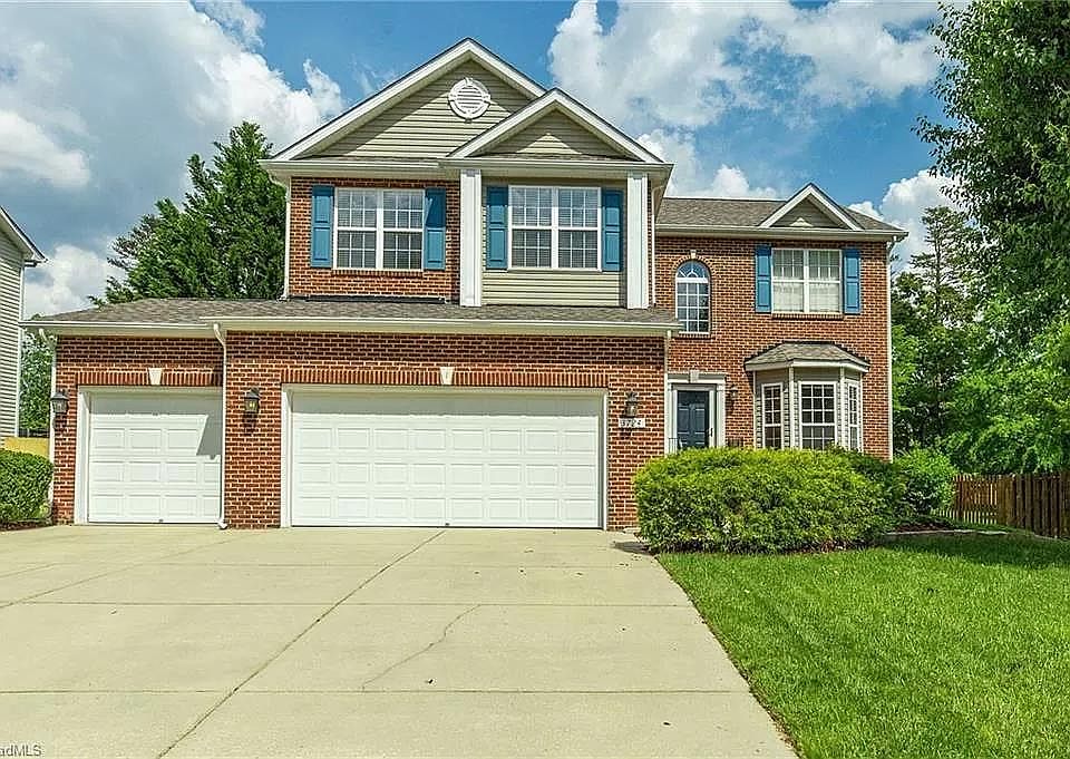 Front entrance and 3 car garage