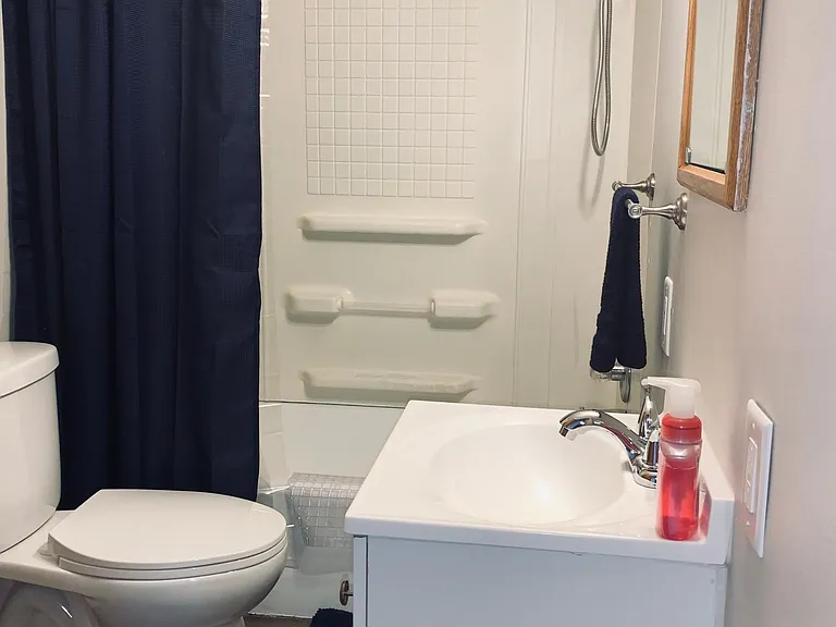 Bathroom with tub and shower.