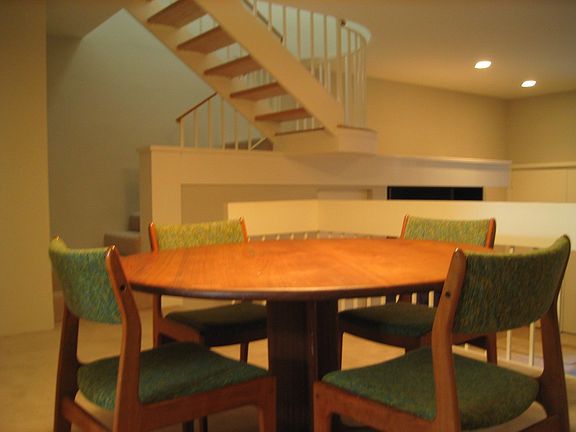 Dining Room with floating stairway