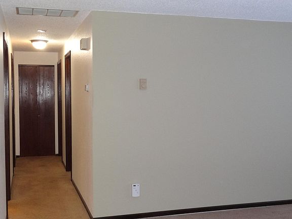 Hallway with closet at the end