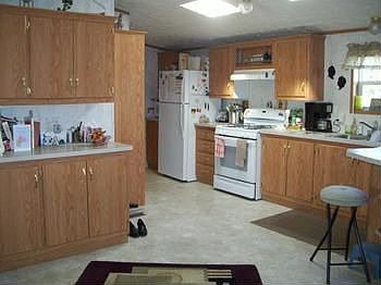 Loads of cabinets and countertops in this kitchen.