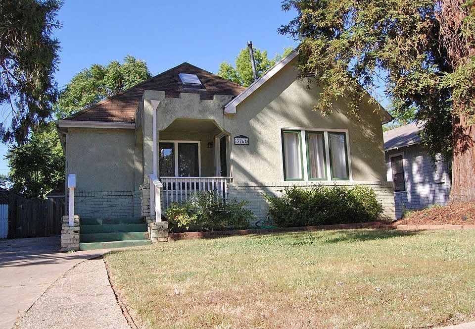 Bungalow with cedar tree