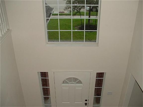 View of entryway from the stairs.  Very light and bright