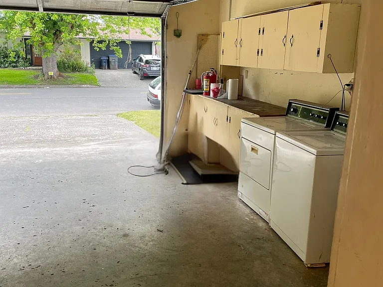 Large Garage with Lots of Cabinet Space
Also Shows Washer and Gas Dryer