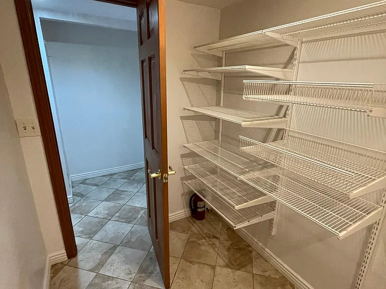 Extra room can be used as pantry, walk in closet or storage room.