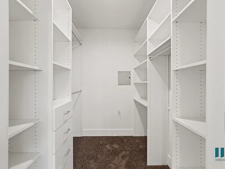 Walk-In a closet with Built-In Organizers and Shelving