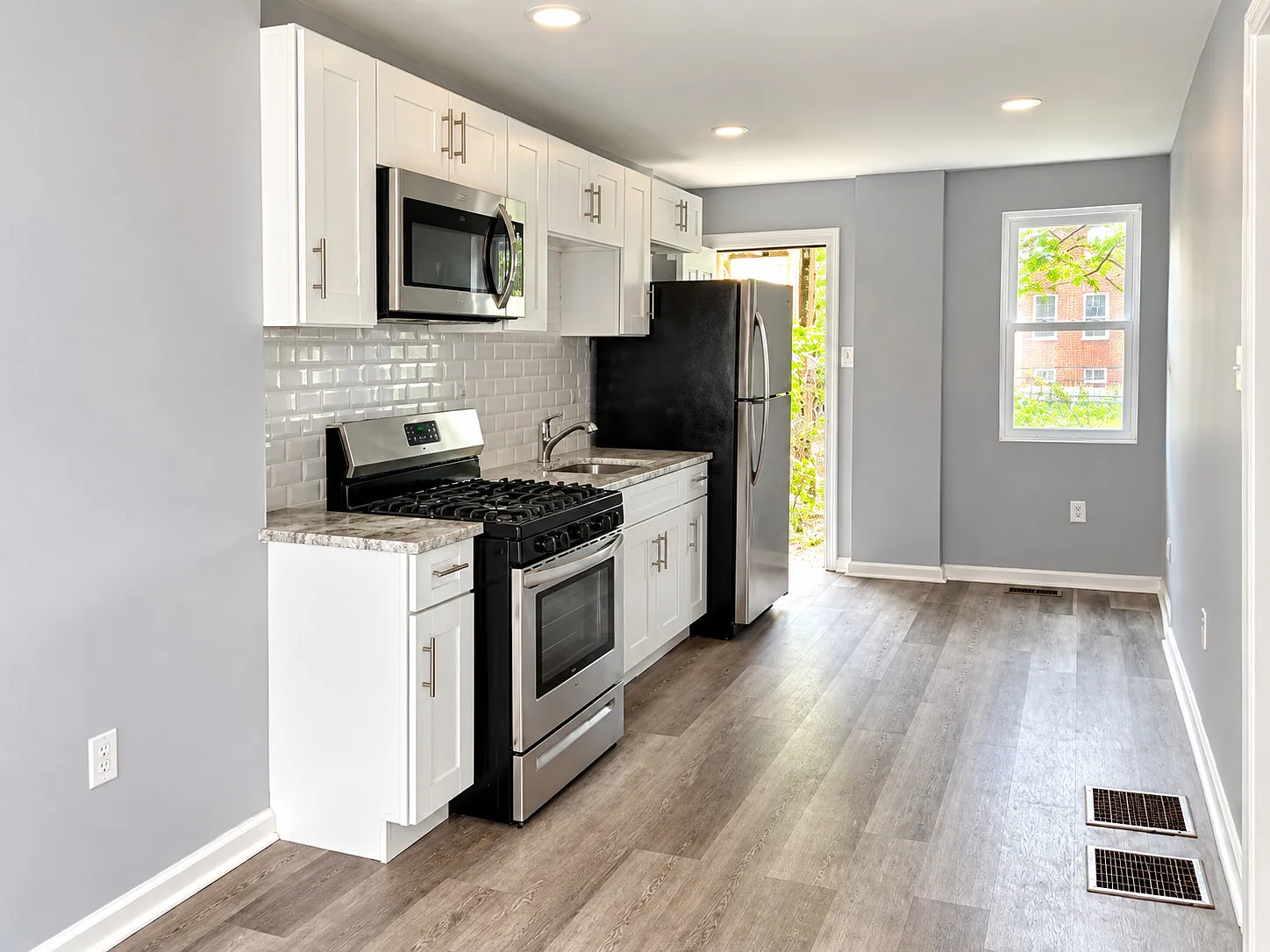 Bright 2-Bedroom Home with a Stylish Kitchen & Central Air — Photo 2