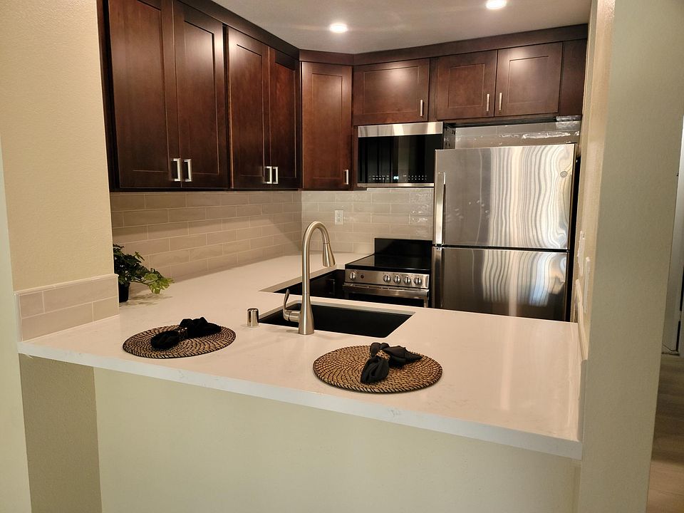 Kitchen with all new appliances and granite countertop.