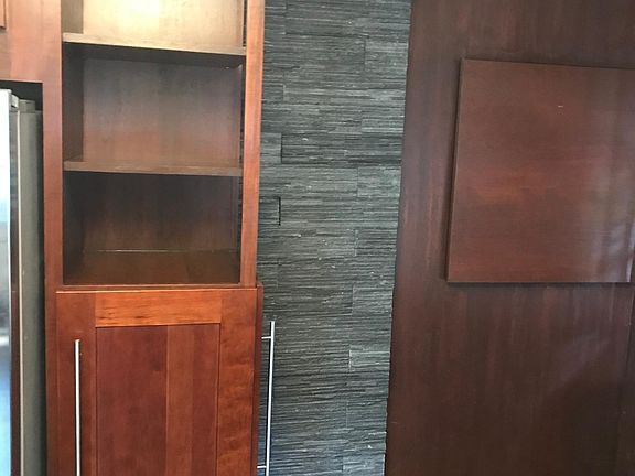 Hidden electric panel, pantry cabinet in kitchen