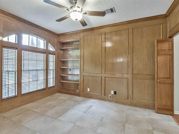 The Study/library showcases built-in bookshelves, and Tile floors