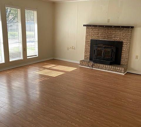 Entering the home from the carport into the Living Room - a door to the far right is a room for a dryer and storage - room not seen - photo coming