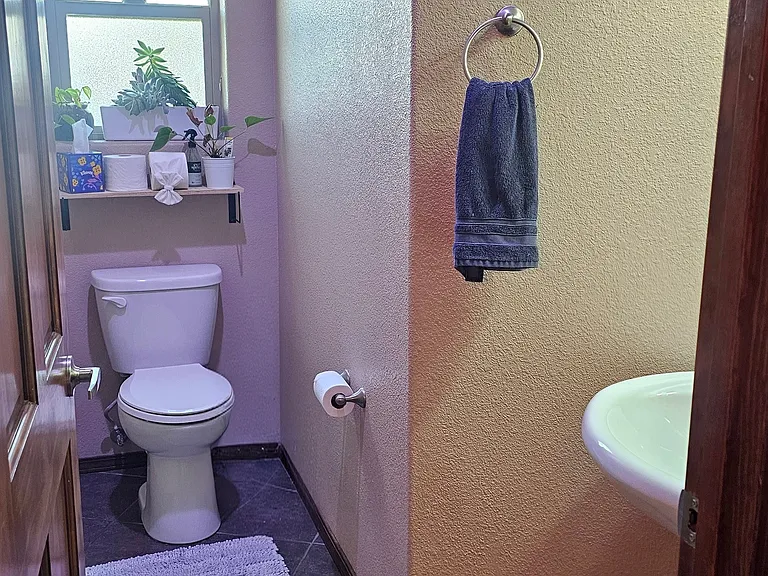 Half bath by the kitchen and dining room area