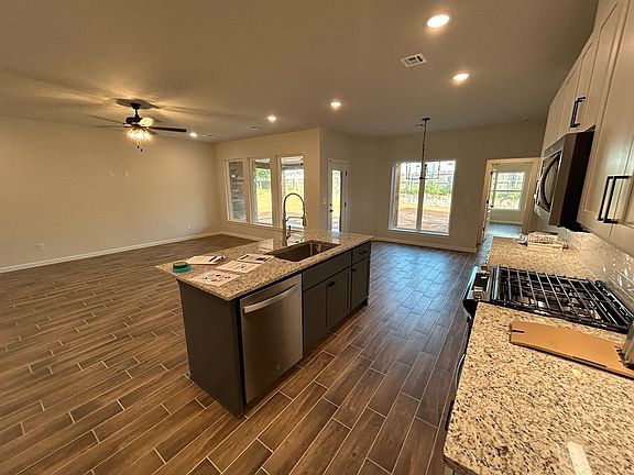 Kitchen, dining area, and living room
