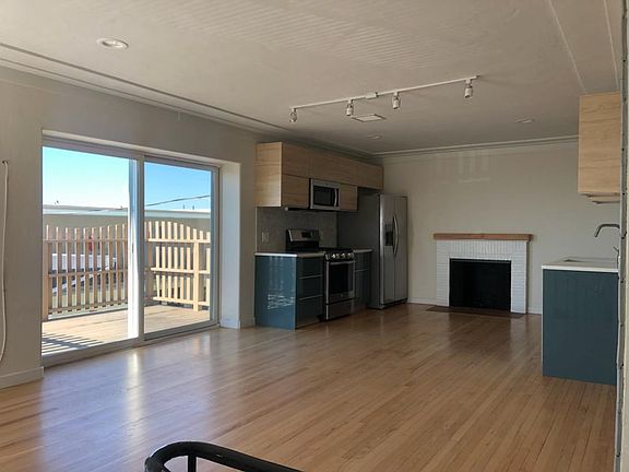 L/R area looking N to Ikea Kitchen and Fireplace Ocean in background