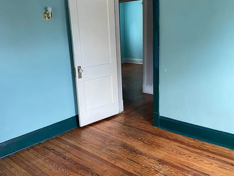Larger bedroom on the 2nd floor with two small closets.