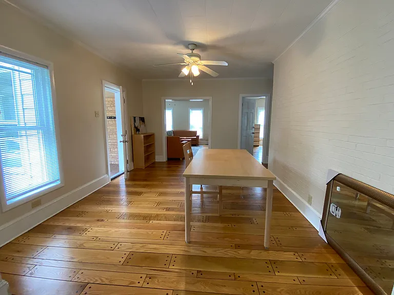 Dining room with six chairs. (chairs missing from picture)