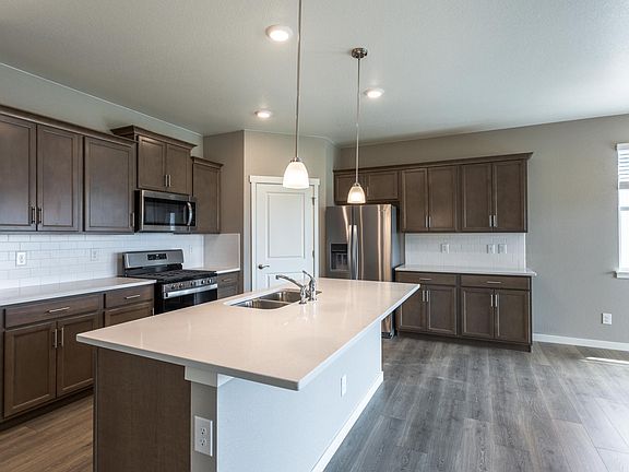Kitchen with large pantry and eat-in island