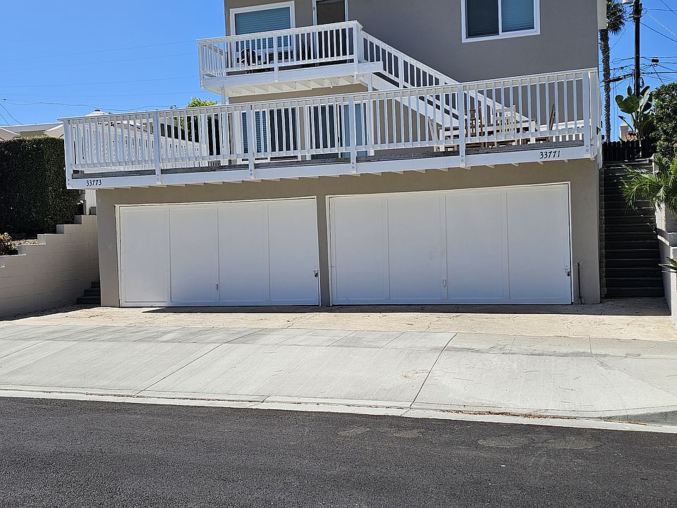 Front view of house, exclusive oceanview deck over two 2 car garages, new windows, new paint