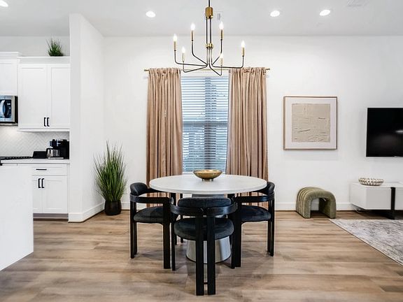 Charming dining area with a cozy ambiance, ideal for hosting and enjoying meals