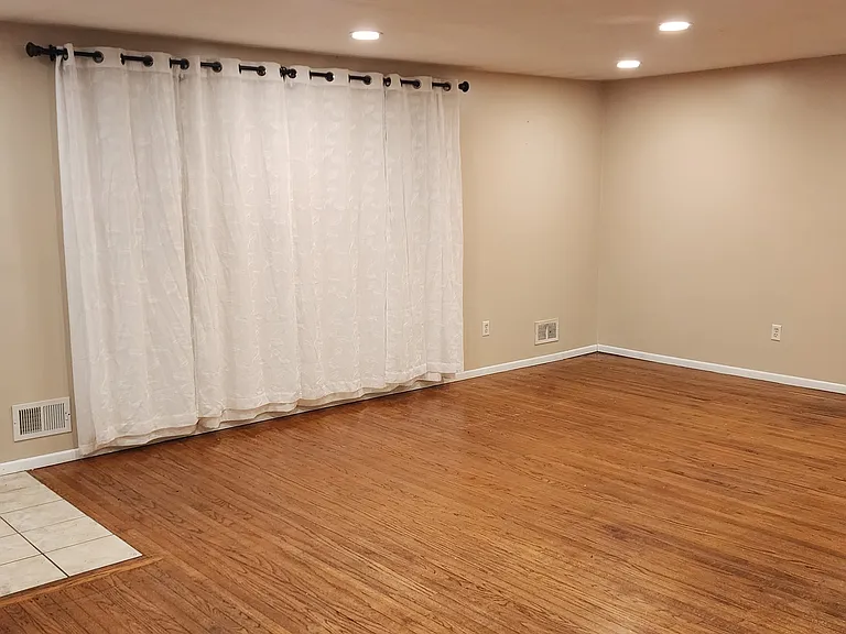 Living Room with front door entry, From the Dining Area