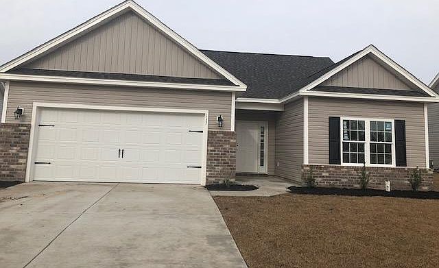 Anterior of the house with two car garage