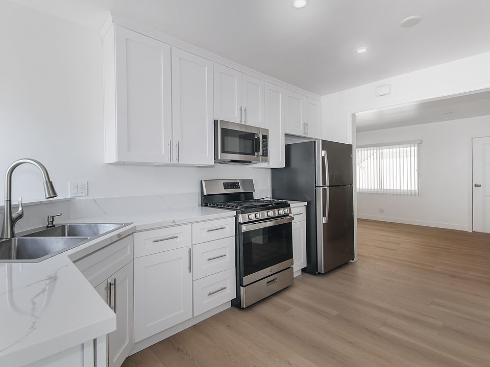 Renovated Kitchen leading into Living Room