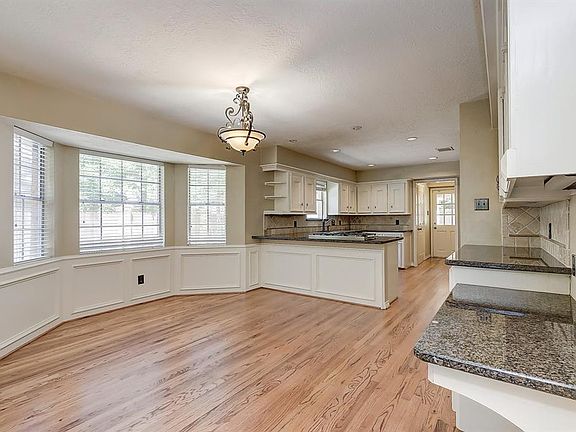 Natural light floods through three bay windows providing lots of light throughout the entire kitchen area.