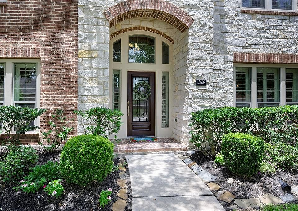 Beautiful Stone & Brick exterior with inviting front porch to welcome you.