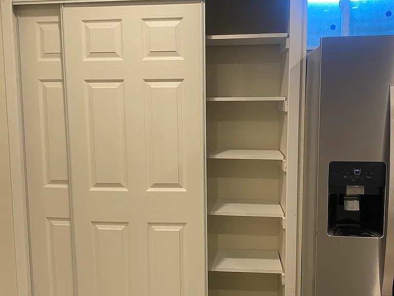 Pantry in kitchen with ample storage.