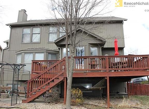 Patio, firepit, wood fenced, deck, separate stairs for doggy door from laundry room.