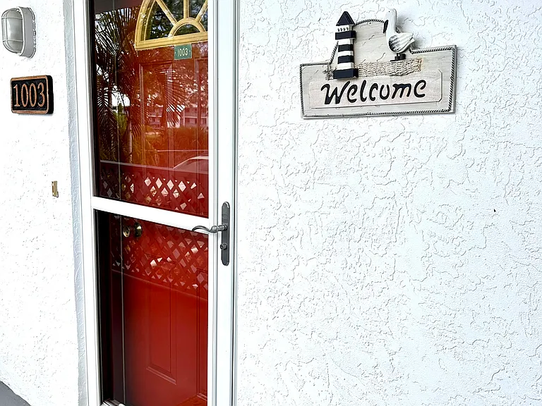 Welcome to your home away from home! __ There is nothing quite like being greeted by a friendly sign to let you know your vacation has officially begun. We've made sure every detail of Unit 1003 feels inviting from the moment you step up to the front door