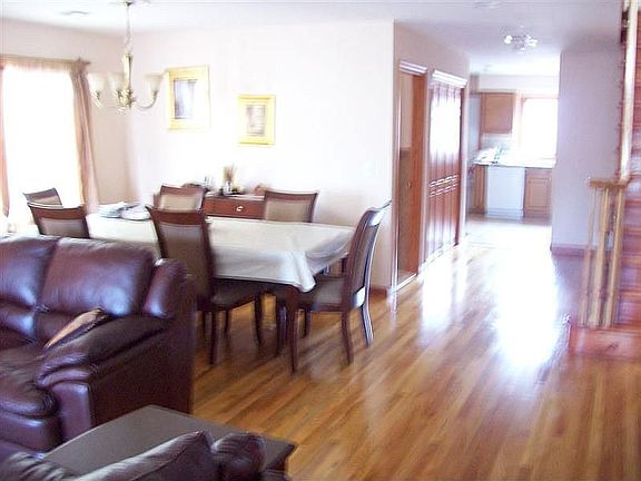 view of the dining room and kitchen from the living room