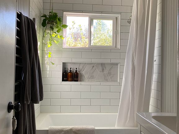Updated bathroom with soaker tub and shower. Heated towel rack and tons of storage!