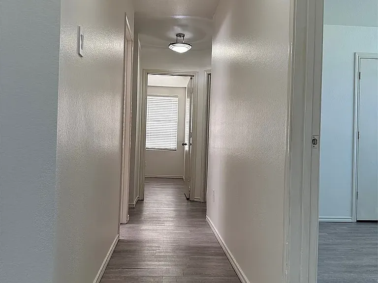 Front hallway leading to 3 bedrooms and full bath