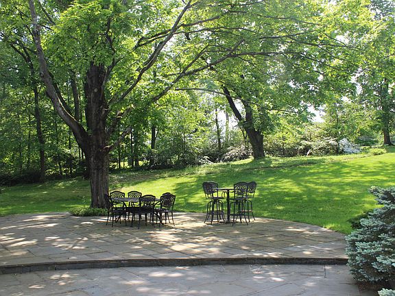 This fabulous home is situated on 3.2 very private acres offering breathtaking vistas across rolling lawns with magnificent specimen trees.