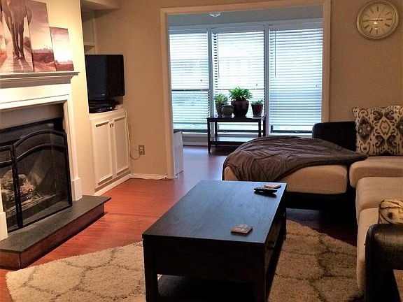 furnished living area (rents unfurnished) with sunroom view