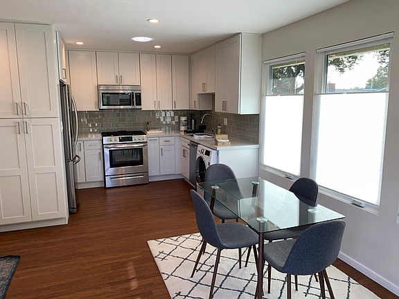 Gourmet kitchen and dining area with tons of light.
