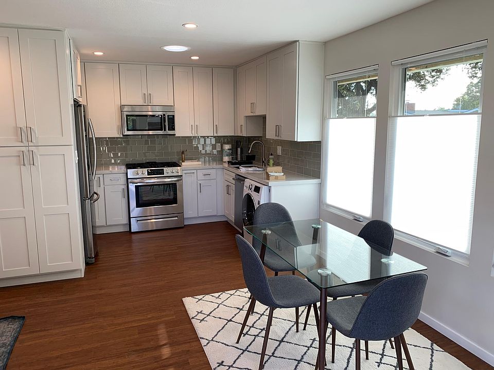 Gourmet kitchen and dining area with tons of light.