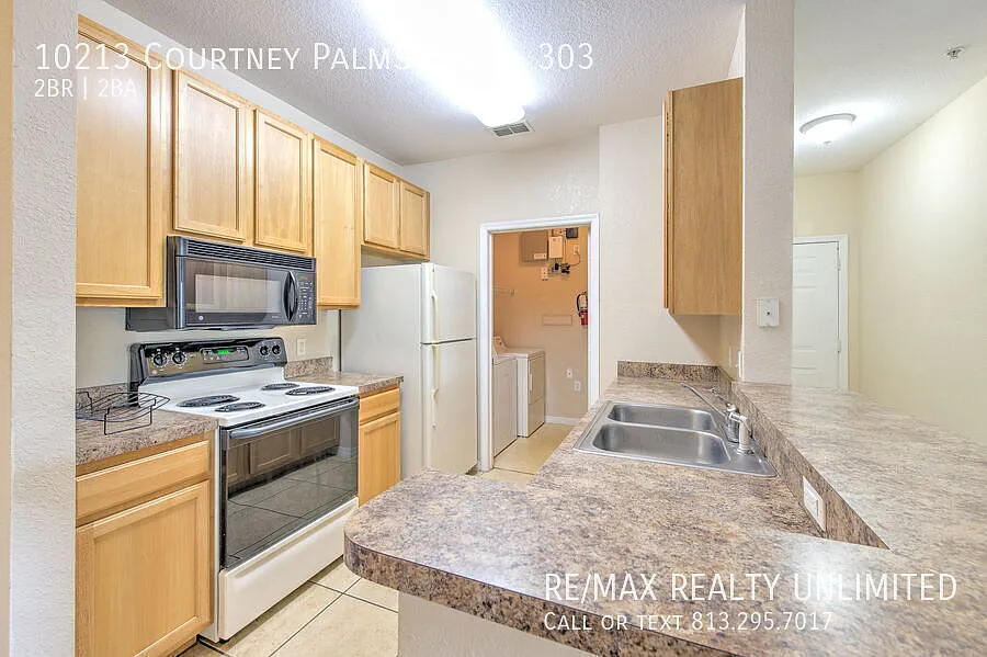10213 Courtney Palms Blvd #303 Tampa, FL 33619 — Photo 4