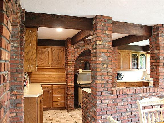 Roll top bread box, great space to hide your kitchen aid or wet bar.  No matter what you decide with all this space, you have plenty of options