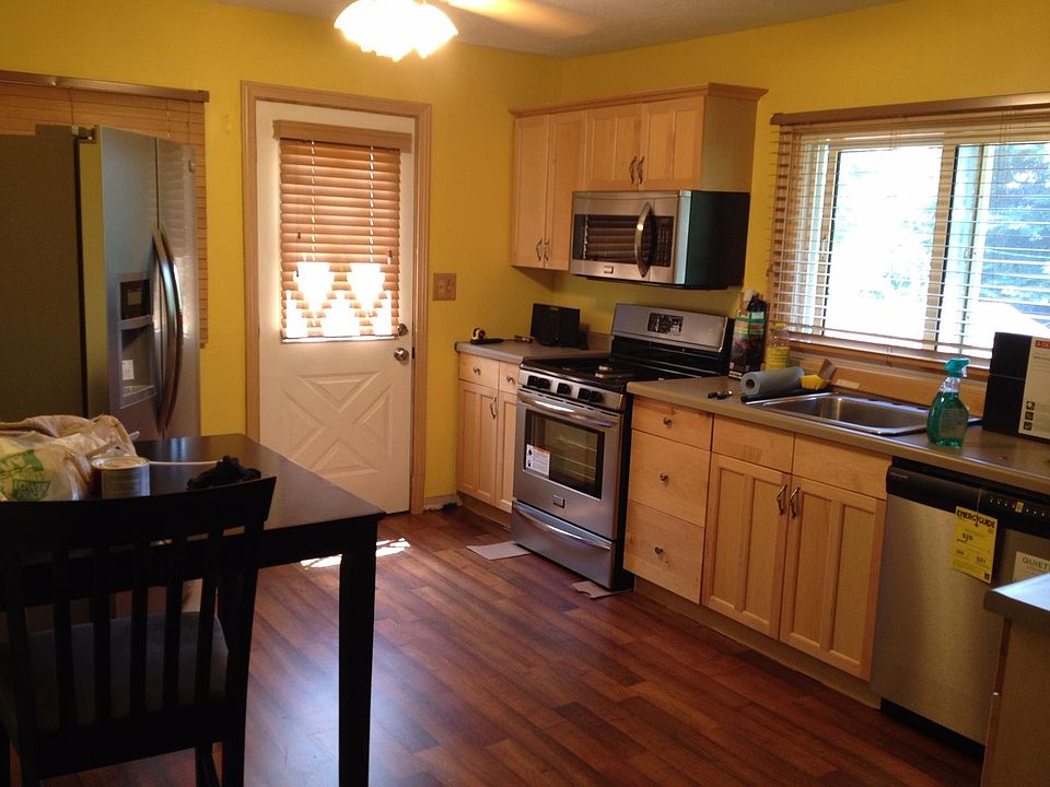 Kitchen with new stainless steel appliances and beautiful flooring