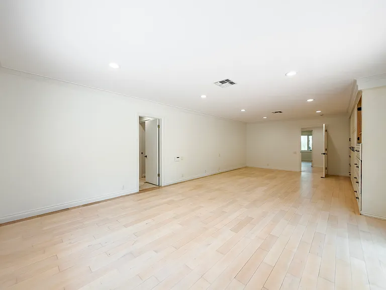 Spacious bonus room with rich hardwood floors offers flexible living space in this Beverly Hills luxury rental home at 1094 Garden Lane, a premier 90210 home for rent.