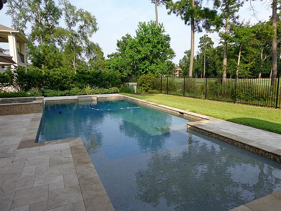 Saltwater heated pool/spa surrounded by travertine in a serene setting. Located on #1 fairway away f