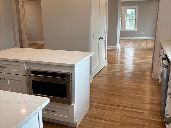 Kitchen - New hardwood floors, new cabinets, new countertops, new appliances, new windows, new doors, new insulation, new sheetrock, new electrical and Plumbing.