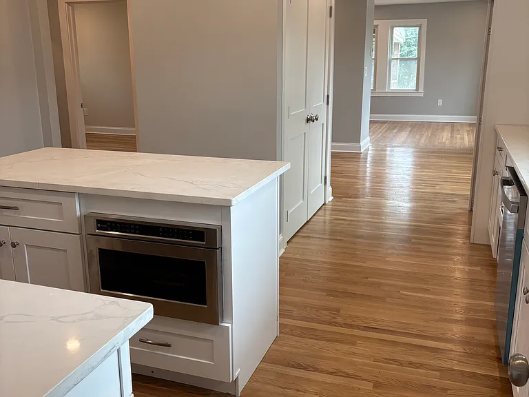 Kitchen - New hardwood floors, new cabinets, new countertops, new appliances, new windows, new doors, new insulation, new sheetrock, new electrical and Plumbing.
