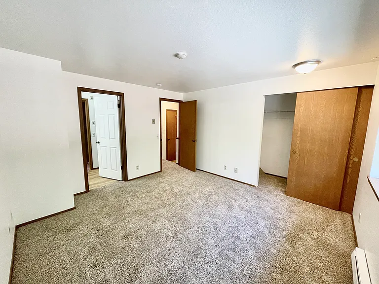 Front Bedroom with closet and access to bathroom.