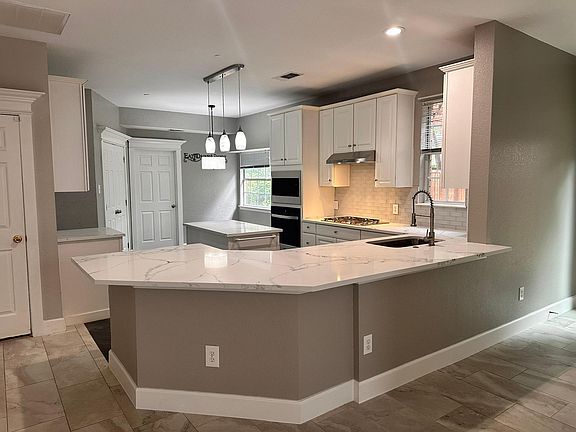 Kitchen with large counter for sitting