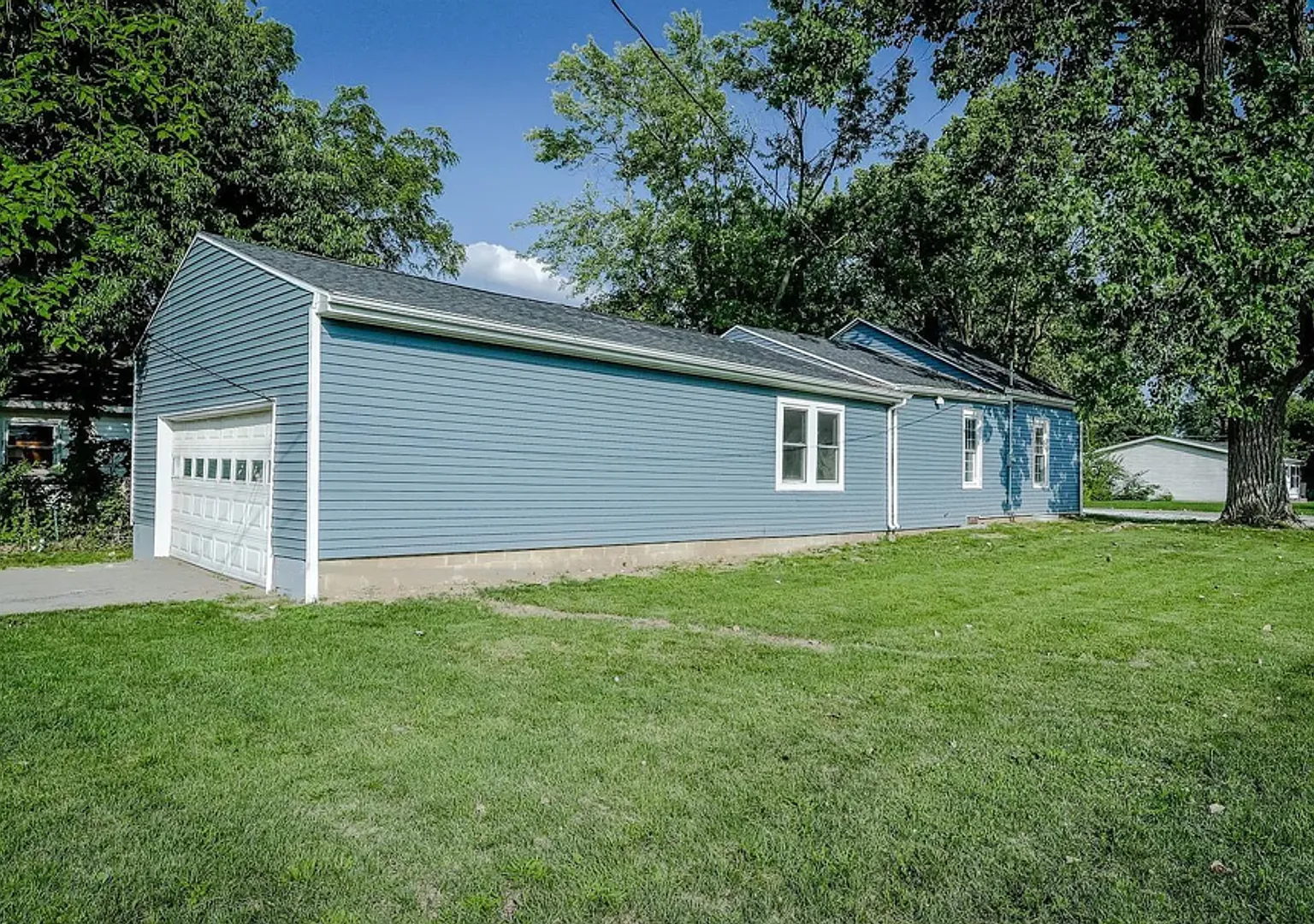 Newly Renovated 1.5-Story Home with Attached Garage & Deck — Photo 4